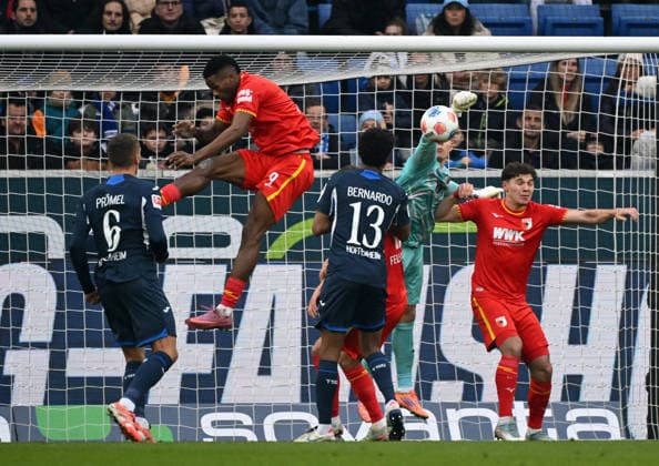RECORD DATE NOT STATED 29.11.2025, xjhx, Fussball 1.Bundesliga, TSG 1899 Hoffenheim - FC Augsburg v.l. Bernardo (1899 Hoffenheim), Finn Dahmen (FC Augsburg) (DFL DFB REGULATIONS PROHIBIT ANY USE OF PHOTOGRAPHS as IMAGE SEQUENCES and or QUASI-VIDEO) Sinsheim