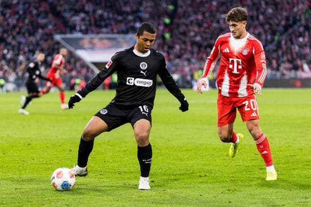 MUENCHEN, GERMANY - NOVEMBER 29: Joel Chima Fujita (FC St. Pauli, 16) controls the ball against Tom Bischof (FC Bayern Muenchen, 20) during the Bundesliga match between FC Bayern Muenchen vs. FC St. Pauli at Allianz Arena on matchday 12 of the 1. Bundesliga on November 29, 2025 in Muenchen, Germany. DFL REGULATIONS PROHIBIT ANY USE OF PHOTOGRAPHS AS IMAGE SEQUENCES AND OR QUASI-VIDEO. Bayern Germany Copyright: xBEAUTIFULxSPORTS Wunderlx