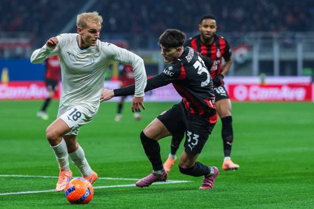 AC Milan vs SS Lazio - Serie A 2025 26 - 29 11 2025 Christopher Alan Nkunku of AC Milan competes for the ball with Davide Bartesaghi of AC Milan during Serie A 2025 26 football match between AC Milan and SS Lazio at San Siro Stadium in Milan Copyright: xBEAUTIFULxSPORTS Carabellix