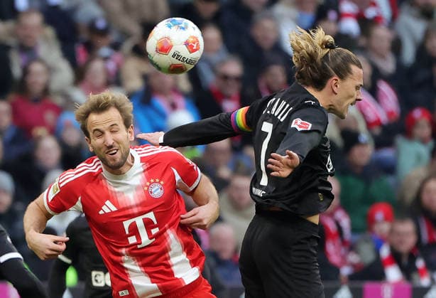 29.11.2025,1. Bundesliga, FC Bayern Muenchen vs St Pauli, Allianz Arena Muenchen, Fussball, im Bild: Harry Kane (FC Bayern Muenchen) vs Jackson Irvine (St Pauli)