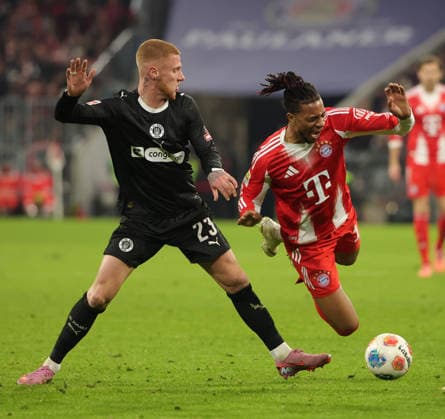 (251130) -- MUNICH, Nov. 30, 2025 -- Michael Olise (R) of FC Bayern Munich vies with Louis Oppie of FC St. Pauli during the German first division Bundesliga football match between FC Bayern Munich and FC St. Pauli in Munich, Germany, Nov. 29, 2025. (Photo by Xinhua) (SP)GERMANY-MUNICH-FOOTBALL-BUNDESLIGA-BAYERN MUNICH VS ST. PAULI PhilippexRuiz 
