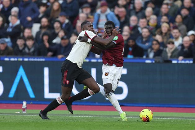 30th November 2025; London Stadium, London, England; Premier League Football, West Ham United versus Liverpool; Ibrahima Konate of Liverpool and El Hadji Malick Diouf of West Ham United hold onto each other while competing for the ball  KatiexChan