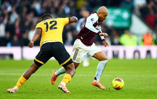 Donyell Malen of Aston Villa and Emmanuel Agbadou of Wolverhampton Wanderers. Aston Villa v Wolverhampton Wanderers, Premier League, Football, Villa Park, Birmingham, UK - 30 Nov 2025Birmingham Villa Park United Kingdom EDITORIAL USE ONLY No use with unauthorised audio, video, data, fixture lists, club league logos or live services. Online in-match use limited to 120 images, no video emulation. No use in betting, games or single club league player publications.  Copyright: xJamesxMarsh Shutterstockx 15941716az