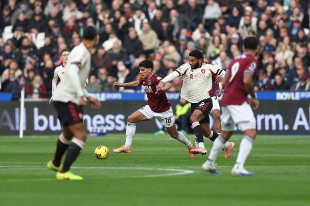 30th November 2025; London Stadium, London, England; Premier League Football, West Ham United versus Liverpool; Mateus Fernandes of West Ham United dribbles past Joe Gomez of Liverpool  KatiexChan