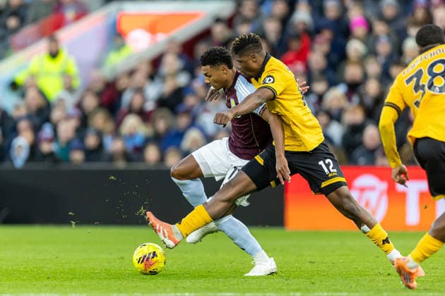 Aston Villa v Wolverhampton Wanderers Premier League 30 11 2025. Aston Villa forward Ollie Watkins (11) battles for possession with Wolverhampton Wanderers defender Emmanuel Agbadou (12) during the Premier League match between Aston Villa and Wolverhampton Wanderers at Villa Park, Birmingham, England on 30 November 2025. Birmingham Villa Park West Midlands England Editorial use only DataCo restrictions apply See www.football-dataco.com , Copyright: xManjitxNarotrax PSI-23320-0041