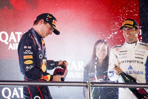 DOHA - Max Verstappen (Red Bull Racing) on the podium with Carlos Sainz (Williams) and Hannah Schmitz (Red Bull Racing s chief strategy engineer) after winning the Qatar Grand Prix at the Lusail International Circuit. ANP SANDER KONING xVIxANPxSportx xxANPxIVx 543498075 originalFilename: 543498075.jpg