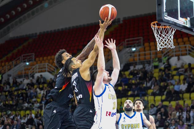FIBA World Cup Qualifiers : Cyprus vs Germany NORRIS AGBAKOKO of Germany and JOSHUA OBIESIE of Germany compete for the ball with IOANNIS GIANNARAS of Cyprus. Cyprus plays vs Germany for the Group E of the FIBA Basketball World Cup European Qualifiers, at Spyros Kyprianou Arena, Limassol, Cyprus, on Dec. 1, 2025. Limassol Cyprus Copyright: xKOSTASxPIKOULASx