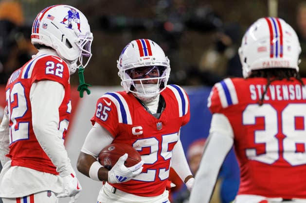 New England Patriots cornerback Marcus Jones (C) celebrates his touchdown against the New York Giants with New England Patriots cornerback Charles Woods (L) and New England Patriots running back Rhamondre Stevenson (R) during the first half at Gillette Stadium in Foxborough, Massachusetts on Monday, December 01, 2025.  BOP20251201013 CJxGUNTHER