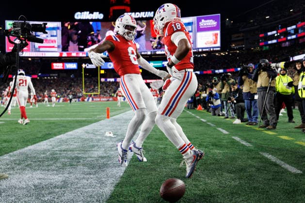 New England Patriots wide receiver Kyle Williams (R) celebrates his touchdown against the New York Giants with New England Patriots wide receiver Stefon Diggs (L) during the first half at Gillette Stadium in Foxborough, Massachusetts on Monday, December 01, 2025.  BOP20251201020 CJxGUNTHER