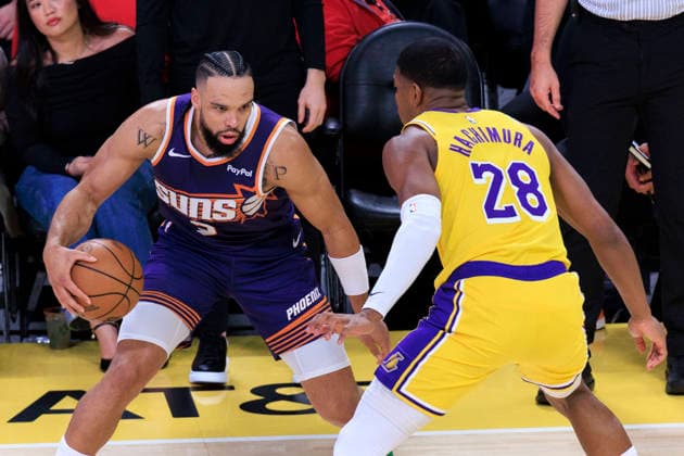 December 1, 2025, Los Angeles, California, USA: Rui Hachimura 28 of the Los Angeles Lakers guards against Dillon Brooks 3 of the Phoenix Suns during their regular season NBA, Basketball Herren, USA game on Monday December 1, 2025 at Crypto.com Arena in Los Angeles, California. ARIANA RUIZ PI Los Angeles USA - ZUMAp124 20251201_zaa_p124_004 Copyright: xArianaxRuizx