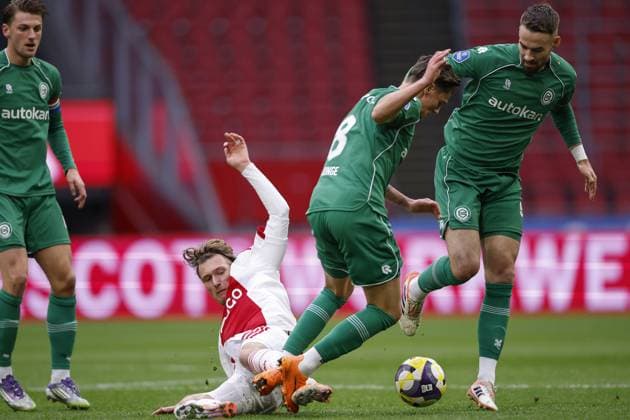AMSTERDAM - (l-r) Mika Godts of Ajax, Tika de Jonge of FC Groningen, Younes Taha El Idrissi of FC Groningen during the Dutch Eredivisie match between AFC Ajax and FC Groningen at the Johan Cruijff ArenA on December 2, 2025 in Amsterdam, Netherlands. ANP Hollandse Hoogte MAURICE VAN STEEN Eredivisie 2025-2026 xVIxANPxSportx xMauricexvanxSteenxIVx 543669378 originalFilename: 543669378.jpg