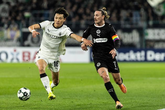 DFB-Pokal: Borussia Mönchengladbach - FC St. Pauli; 02.12.2025 Jackson Irvine (FC St. Pauli, 7), Shuto Machino (Borussia Mönchengladbach, 18) DFB-Pokal: Borussia Mönchengladbach - FC St. Pauli; Borussia-Park, Mönchengladbach; 02.12.2025 DFB regulations prohibit any use of photographs as image sequences and or quasi video. Copyright: xBEAUTIFULxSPORTS Buriakovx