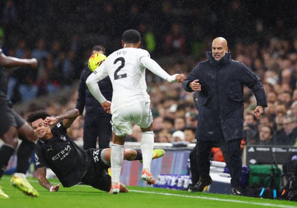 London, England, 2nd December 2025. Pep Guardiola coach of Manchester City (r) rects to a coming together of Nico O™Reilly of Manchester City and Kenny Tete of Fulham during the Fulham vs Manchester City Premier League match at Craven Cottage, London. Picture credit should read: Nigel Roddis Sportimage EDITORIAL USE ONLY. No use with unauthorised audio, video, data, fixture lists, club league logos or live services. Online in-match use limited to 120 images, no video emulation. No use in betting, games or single club league player publications. SPI_018_PT_Fulham_Man_City SPI-4339-0018