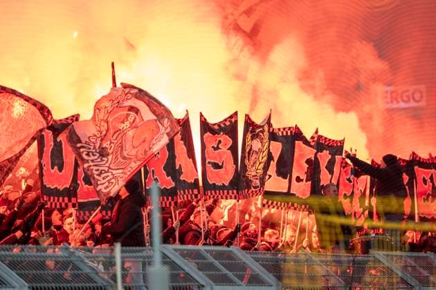 Gästefans mit Pyrotechnik. Fans von Bayer Leverkusen. Guest fans with pyrotechnics. Fans of Bayer Leverkusen. Borussia Dortmund - Bayer Leverkusen, DFB Pokal Achtelfinale (Round of 16) in Dortmund, Signal Iduna Park DFL regulations prohibit any use of photographs as image sequences and or quasi-video. Copyright: HMBxMedia xMarcoxBader
