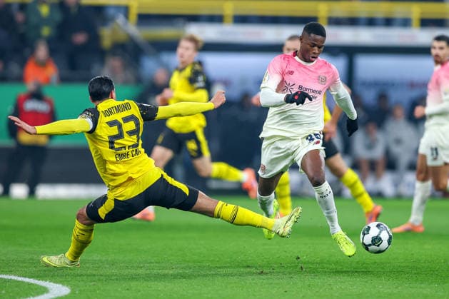 02.12.2025, Fußball, DFB-Pokal, Borussia Dortmund - Bayer 04 Leverkusen, Achtelfinale, Signal Iduna Park, Saison 2025 2026: Emre Can (BVB 23) im Zweikampf gegen Christian Kofane (Bayer04 35) DFB regulations prohibit any use of photographs as image sequences and or quasi-video. Nordrhein-Westfalen Deutschland
