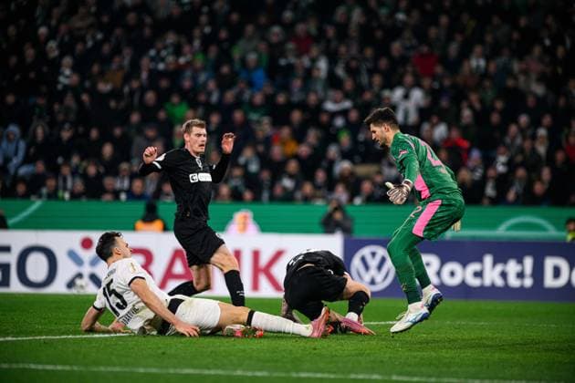 MOENCHENGLADBACH, GERMANY - 2 DECEMBER, 2025: Haris Tabakovic, Nikola Vasilj - The DFB Pokal, German Cup, match Borussia vs St.Pauli at Borussia Park.  Copyright: xVitaliixKliuievx