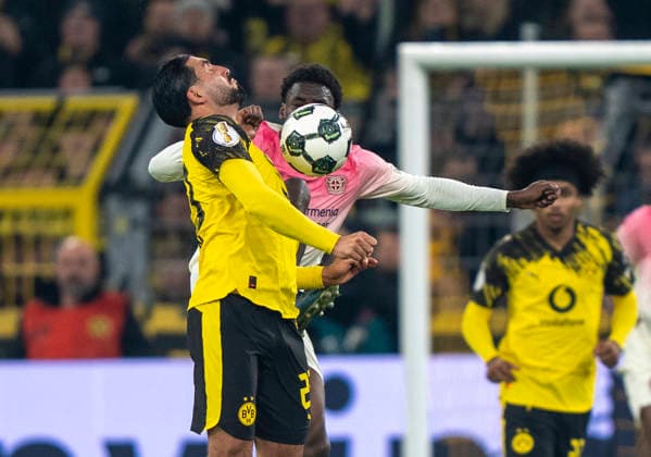 Zweikampf zwischen: duel between: Ernest POKU (Bayer 04 Leverkusen, 19) and Emre CAN (Borussia Dortmund, 23) Borussia Dortmund - Bayer Leverkusen, DFB Pokal Achtelfinale (Round of 16) in Dortmund, Signal Iduna Park DFL regulations prohibit any use of photographs as image sequences and or quasi-video. Copyright: HMBxMedia xMarcoxBader