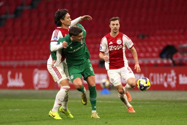 Ko Itakura of AFC Ajax battles for the ball with Brynjolfur Willumsson of FC Groningen during the match AFC Ajax Amsterdam vs FC Groningen at the Johan Cruijff ArenA for the Dutch Vriendenloterij Eredivisie season 2025-2026 in AMSTERDAM, Netherlands on 1 december 2025, (photo by Peter Lous EYE4images DeFodi Images)