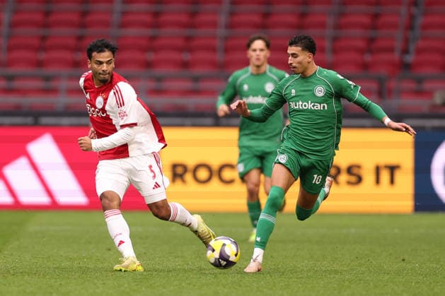 Owen Wijndal of AFC Ajax with Younes Taha El Idrissi of FC Groningen during the match AFC Ajax Amsterdam vs FC Groningen at the Johan Cruijff ArenA for the Dutch Vriendenloterij Eredivisie season 2025-2026 in AMSTERDAM, Netherlands on 1 december 2025, (photo by Peter Lous EYE4images DeFodi Images)
