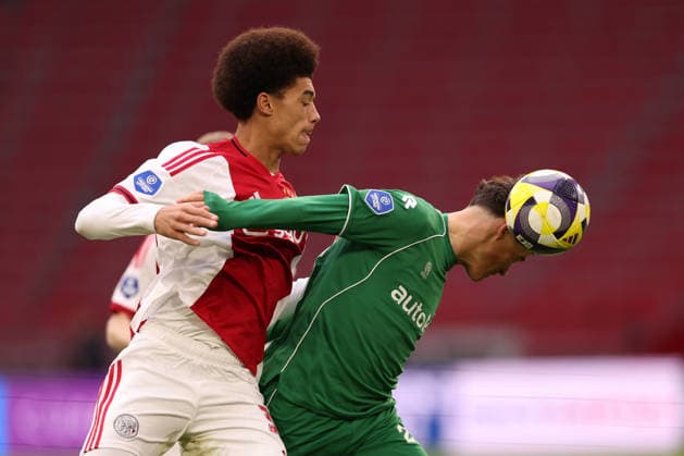 Aaron Bouwman of AFC Ajax battles for the ball with Thom van Bergen of FC Groningen during the match AFC Ajax Amsterdam vs FC Groningen at the Johan Cruijff ArenA for the Dutch Vriendenloterij Eredivisie season 2025-2026 in AMSTERDAM, Netherlands on 1 december 2025, (photo by Peter Lous EYE4images DeFodi Images)