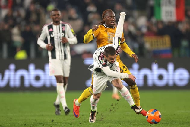 Turin, Italy, 2nd December 2025. Jordan Zemura of Udinese Calcio clashes with Edon Zhegrova of Juventus during the Juventus vs Udinese Coppa Italia match at Allianz Stadium, Turin. Picture credit should read: Jonathan Moscrop Sportimage EDITORIAL USE ONLY. No use with unauthorised audio, video, data, fixture lists, club league logos or live services. Online in-match use limited to 120 images, no video emulation. No use in betting, games or single club league player publications. SPI_071_JM_JUVE_UDINESE_CI SPI-4319-0071