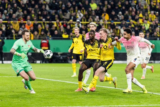 DORTMUND, GERMANY - DECEMBER 2: Mark Flekken (Bayer 04 Leverkusen, 1), Serhou Guirassy (Borussia Dortmund, 9) and Maximilian Beier (Borussia Dortmund, 14) battle for the ball during the DFB Pokal Round of 16 match between Borussia Dortmund vs. Bayer 04 Leverkusen at Signal Iduna Park on Round of Sixteen of the DFB Pokal on December 2, 2025 in Dortmund, Germany. DFB REGULATIONS PROHIBIT ANY USE OF PHOTOGRAPHS AS IMAGE SEQUENCES AND OR QUASI-VIDEO. North Rhine Westphalia Germany Copyright: xBEAUTIFULxSPORTS Wunderlx