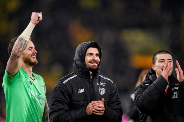 DORTMUND, GERMANY - DECEMBER 2: Bayer 04 Leverkusen goalkeeper Mark Flekken, Martin Terrier of Bayer 04 Leverkusen and Ibrahim Maza of Bayer 04 Leverkusen celebrate their team s win after the DFB Cup round of 16 match between Borussia Dortmund and Bayer 04 Leverkusen at Signal Iduna Park on December 2, 2025 in Dortmund, Germany. (Photo by Rene Nijhuis) SPO  Copyright: xRenexNijhuis