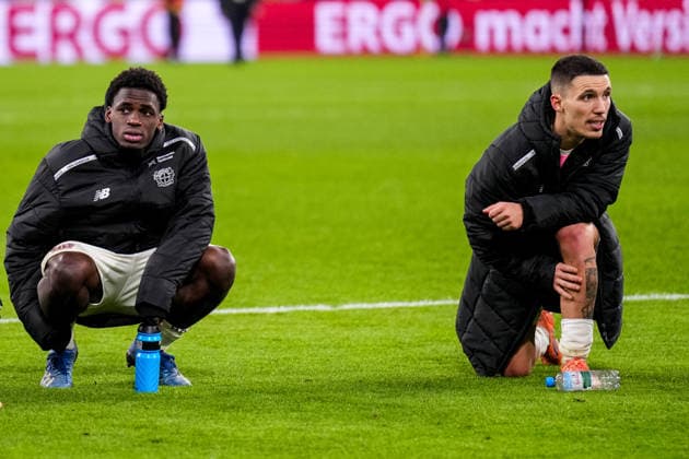 DORTMUND, GERMANY - DECEMBER 2: Ernest Poku of Bayer 04 Leverkusen and Alejandro Grimaldo of Bayer 04 Leverkusen look on after the DFB Cup round of 16 match between Borussia Dortmund and Bayer 04 Leverkusen at Signal Iduna Park on December 2, 2025 in Dortmund, Germany. (Photo by Rene Nijhuis) SPO  Copyright: xRenexNijhuis