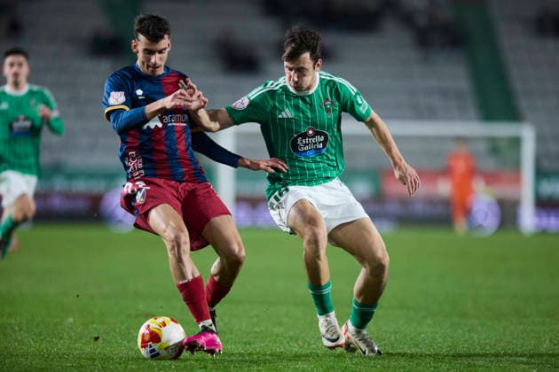Racing Club Ferrol v SD Huesca - Copa del Rey FERROL, SPAIN - DECEMBER 2: Angel Perez of SD Huesca competes for the ball with Aitor Gelardo of Racing Club de Ferrol during the Copa del Rey second round match between Racing Club Ferrol and SD Huesca at Campo Municipal A Malata on December 2, 2025 in Ferrol, Spain. (Photo by Diego Simon Photo Players Images Magara Press) Ferrol Estadio Municipal A Malata Spain Copyright: xDiegoxSimonx