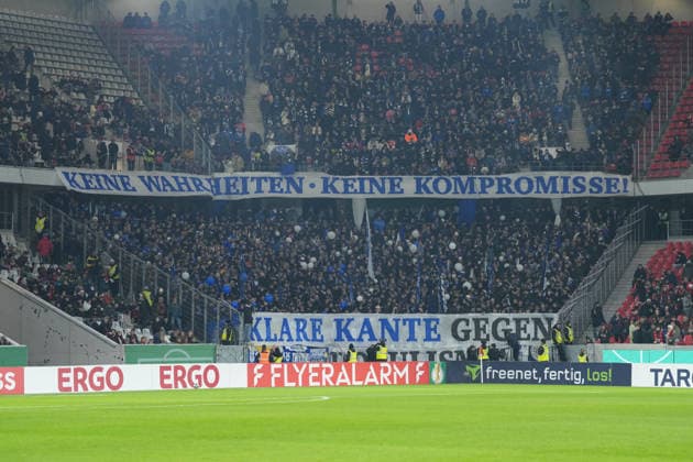 Fanprotest, Protest, Fans, Ultras, Innenministerkonferenz, IMK, Sicherheitsmaßnahmen, personalisierten Tickets, strengere Einlasskontrollen, KI-basierten Gesichtsscanner, Stadionverbote, Bedrohung für die Fankultur, 12 Minuten schweigen, Spruchband , Fußball, Achtelfinale, DFB Pokal, 2025 26, SC Freiburg vs. SV Darmstadt 98, 03.12.2025, Europa-Park Stadion, Freiburg, Deutschland DFB REGULATIONS PROHIBIT ANY USE OF PHOTOGRAPHS AS IMAGE SEQUENCES AND OR QUASI-VIDEO. Freiburg Europa-Park Stadion Baden-Württemberg Deutschland Copyright: xArnexAmbergx
