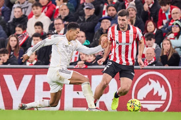 December 3, 2025, Bilbao, Vizcaya, Spain: Jude Bellingham of Real Madrid CF competes for the ball with Jesus Areso of Athletic Club during the LaLiga EA Sports match between Athletic Club and Real Madrid CF at San Mames on December 3, 2025, in Bilbao, Spain. Bilbao Spain - ZUMAa181 20251203_zaa_a181_082 Copyright: xRicardoxLarreinax
