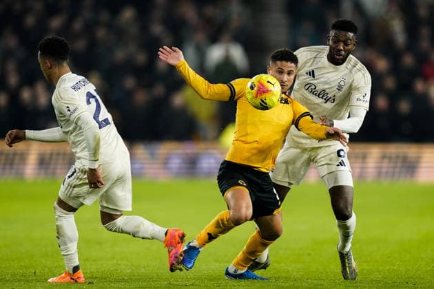 Wolverhampton, England, 3rd December 2025. Joao Gomes of Wolverhampton Wanderers controls the ball whilst under pressure from Ibrahim Sangare of Nottingham Forest during the Wolverhampton Wanderers vs Nottingham Forest Premier League match at Molineux, Wolverhampton. Picture credit should read: Andrew Yates Sportimage EDITORIAL USE ONLY. No use with unauthorised audio, video, data, fixture lists, club league logos or live services. Online in-match use limited to 120 images, no video emulation. No use in betting, games or single club league player publications. SPI_029_AY_WOL_vs_NFO SPI-4341-0029