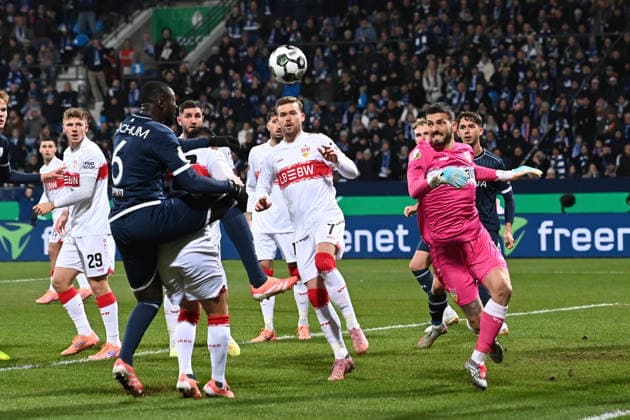 Torwart Fabian BREDLOW (S) pariert eine Torchance vor Ibrahima SISSOKO (BO) Aktion, Zweikampf, Fussball, DFB Pokal, Achtelfinale, Round of 16, VfL Bochum (BO) - VfB Stuttgart (S) 0-2 am 03.12.2025, Vonovia Ruhrstadion Bochum Deutschland. DFL regulations prohibit any use of photographs as image sequences and or quasi-video Â