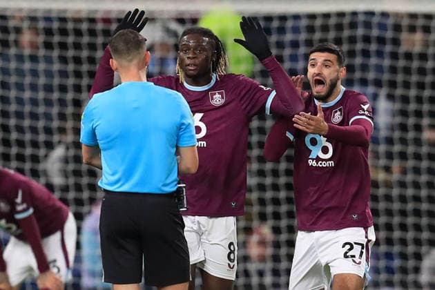 3rd December 2025; Turf Moor, Burnley, Lancashire, England; Premier League Football, Burnley versus Crystal Palace; Lesley Ugochukwu and Armando Broja of Burnley protest to referee Thomas Kirk  DavidxBlunsden