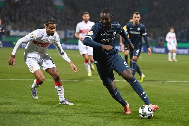 Ibrahima SISSOKO (BO) gegen Lorenz ASSIGNON (S) Aktion, Zweikampf, Fussball, DFB Pokal, Achtelfinale, Round of 16, VfL Bochum (BO) - VfB Stuttgart (S) 0-2 am 03.12.2025, Vonovia Ruhrstadion Bochum Deutschland. DFL regulations prohibit any use of photographs as image sequences and or quasi-video Â