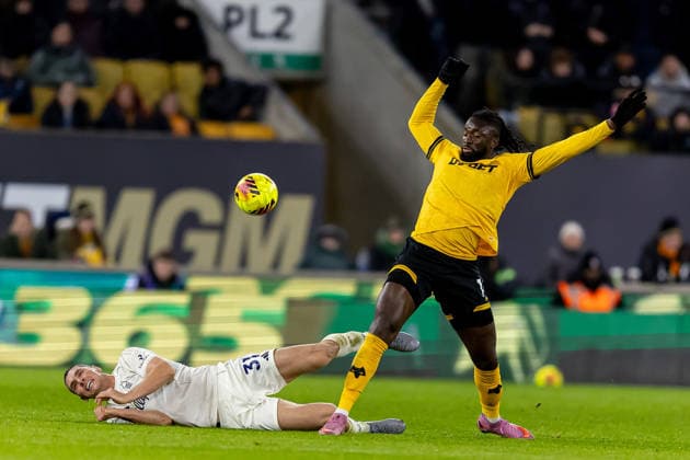 Wolverhampton Wanderers v Nottingham Forest Premier League 03 12 2025. Nottingham Forest defender Nikola Milenkovic (31) bundles over by Wolverhampton Wanderers forward Tolu Arokodare (14) during the Premier League match between Wolverhampton Wanderers and Nottingham Forest at Molineux, Wolverhampton, England on 3 December 2025. Wolverhampton Molineux West Midlands England Editorial use only DataCo restrictions apply See www.football-dataco.com , Copyright: xManjitxNarotrax PSI-23331-0074