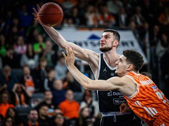 Matas Jogela (Dolomiti Energia Trento) und Diego Garavaglia (ratiopharm ulm) battle for the ball during the Basketball Eurocup match between ratiopharm ulm and Dolomiti Energia Trento at ratiopharm Arena on December 4, 2025 in Neu-Ulm, Germany. (Photo by Harry Langer DeFodi Images)