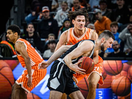 Matas Jogela (Dolomiti Energia Trento) und Alec Anigbata (ratiopharm ulm) battle for the ball during the Basketball Eurocup match between ratiopharm ulm and Dolomiti Energia Trento at ratiopharm Arena on December 4, 2025 in Neu-Ulm, Germany. (Photo by Harry Langer DeFodi Images)