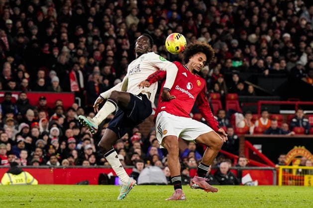 Manchester, England, 4th December 2025. Soungoutou Magassa of West Ham United and Joshua Zirkzee of Manchester United, ManU battle for the ball during the Manchester United vs West Ham United Premier League match at Old Trafford, Manchester. Picture credit should read: Andrew Yates Sportimage EDITORIAL USE ONLY. No use with unauthorised audio, video, data, fixture lists, club league logos or live services. Online in-match use limited to 120 images, no video emulation. No use in betting, games or single club league player publications. SPI_046_AY_MANUTD_WESTHAM SPI-4345-0047