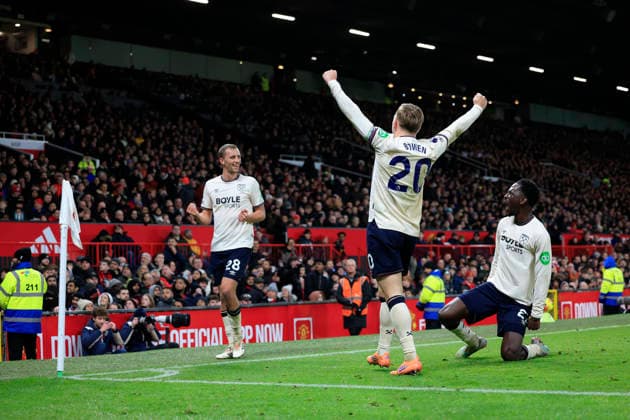 Manchester United, ManU v West Ham United Premier League 04 12 2025. Soungoutou Magassa (27) of West Ham United slides in to celebrates scoring to make it 1-1 during the Premier League match between Manchester United and West Ham United at Old Trafford, Manchester, England on 4 December 2025. Manchester Old Trafford Greater Manchester England Editorial use only DataCo restrictions apply See www.football-dataco.com , Copyright: xConorxMolloyx PSI-23335-0043