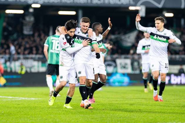 05.12.2025 - Fußball, 2025 2026, 2. Bundesliga, 15. Spieltag, SC Preußen Münster - Hannover 96: (L-R) Daisuke Yokota (Hannover) jubelt nach seinem Tor zum 0:2 mit Enzo Leopold (Hannover) DFL REGULATIONS PROHIBIT ANY USE OF PHOTOGRAPHS AS IMAGE SEQUENCES AND OR QUASI-VIDEO.