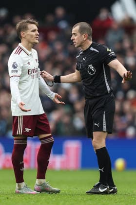 Birmingham, England, 6th December 2025. Martin odegaard of Arsenal talks to referee Peter Bankes during the Aston Villa vs Arsenal Premier League match at Villa Park, Birmingham. Picture credit should read: Gareth Evans Sportimage EDITORIAL USE ONLY. No use with unauthorised audio, video, data, fixture lists, club league logos or live services. Online in-match use limited to 120 images, no video emulation. No use in betting, games or single club league player publications. SPI_053_GE_ASTONVILLA_ARSENAL SPI-4350-0054