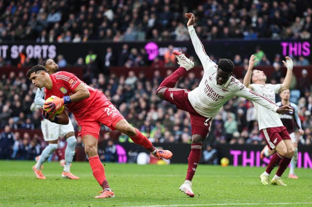 Birmingham, England, 6th December 2025. Bukayo Saka of Arsenal fouls Emi Martinez of Aston Villa during the Aston Villa vs Arsenal Premier League match at Villa Park, Birmingham. Picture credit should read: Gareth Evans Sportimage EDITORIAL USE ONLY. No use with unauthorised audio, video, data, fixture lists, club league logos or live services. Online in-match use limited to 120 images, no video emulation. No use in betting, games or single club league player publications. SPI_069_GE_ASTONVILLA_ARSENAL SPI-4350-0070