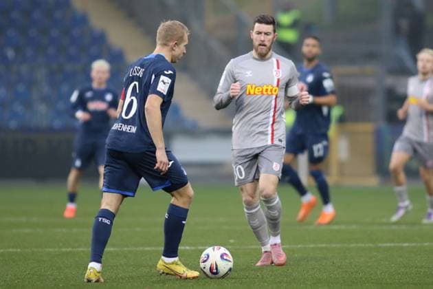 Valentin Laessig (TSG Hoffenheim II, 6), Christian Kuehlwetter (SSV Jahn Regensburg, 30). GER, TSG 1899 Hoffenheim II gegen SSV Jahn Regensburg, Fussball, 3.Liga, 17.Spieltag, Spielzeit 2025 2026, 06.12.2025 (DFL DFB REGULATIONS PROHIBIT ANY USE OF PHOTOGRAPHS as IMAGE SEQUENCES and or QUASI-VIDEO). GER,TSG 1899 Hoffenheim II gegen SSV Jahn Regensburg, Fussball, 3.Liga, 17.Spieltag, Spielzeit 2025 2026, 06.12.2025 Hoffenheim Copyright: xEibner-Pressefoto JoergxHirschx EP_JHH