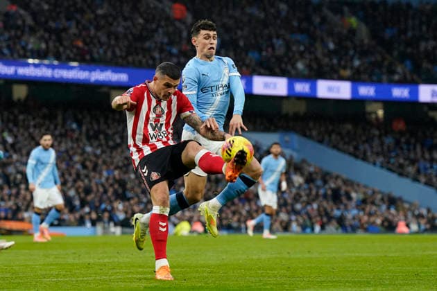 Manchester, England, 6th December 2025. Granit Xhaka of Sunderland and Phil Foden of Manchester City challenge for the ball during the Manchester City vs Sunderland Premier League match at the Etihad Stadium, Manchester. Picture credit should read: Andrew Yates Sportimage EDITORIAL USE ONLY. No use with unauthorised audio, video, data, fixture lists, club league logos or live services. Online in-match use limited to 120 images, no video emulation. No use in betting, games or single club league player publications. SPI_018_AY_Man_City_Sunderland SPI-4351-0018