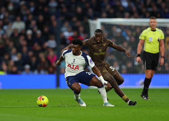6th December 2025; Tottenham Hotspur Stadium, London, England; Premier League Football, Tottenham Hotspur versus Brentford; Mohammed Kudus of Tottenham Hotspur closely marked by Michael Kayode of Brentford  JohnxPatrickxFletcher