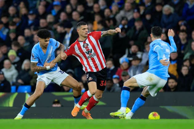 Manchester City v Sunderland Premier League 06 12 2025. Granit Xhaka (34) of Sunderland is held back by Nico O Reilly (33) of Manchester City during the Premier League match between Manchester City and Sunderland at the Etihad Stadium, Manchester, England on 6 December 2025. Manchester Etihad Stadium Manchester England Editorial use only DataCo restrictions apply See www.football-dataco.com , Copyright: xConorxMolloyx PSI-23347-0048