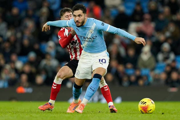 Manchester, England, 6th December 2025. Rayan Cherki of Manchester City with the ball ahead of Trai Hume of Sunderland during the Manchester City vs Sunderland Premier League match at the Etihad Stadium, Manchester. Picture credit should read: Andrew Yates Sportimage EDITORIAL USE ONLY. No use with unauthorised audio, video, data, fixture lists, club league logos or live services. Online in-match use limited to 120 images, no video emulation. No use in betting, games or single club league player publications. SPI_027_AY_Man_City_Sunderland SPI-4351-0027