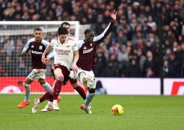 Declan Rice (A) Amadou Onana (AV) at the Aston Villa v Arsenal EPL match, at Villa Park, Birmingham, UK on 6th December, 2025. 