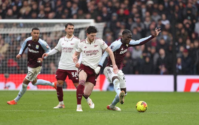 Declan Rice (A) Amadou Onana (AV) at the Aston Villa v Arsenal EPL match, at Villa Park, Birmingham, UK on 6th December, 2025. 